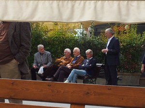 A flock of common Italian men, one with olive branch. Photo J Finnigan