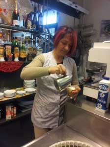 Laura with vibrant red hair and designer finger nails. Photo J Finnigan