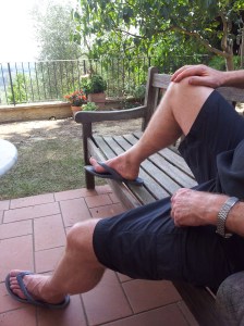 My gorgeous man in designer flip flops.  (If you think your man has a better pear of legs than man, I challenge you to send a picture) foto  J Finnigan