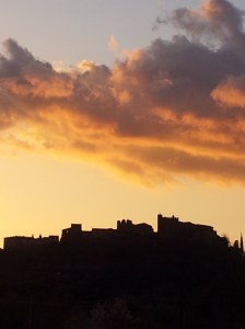 The ancient hill town of Certaldo Alto, silhoueted against the sunset. Photo J Finnigan